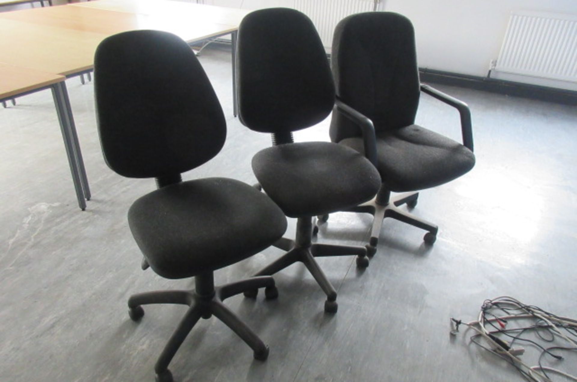 Two swivel chairs and a swivel armchair