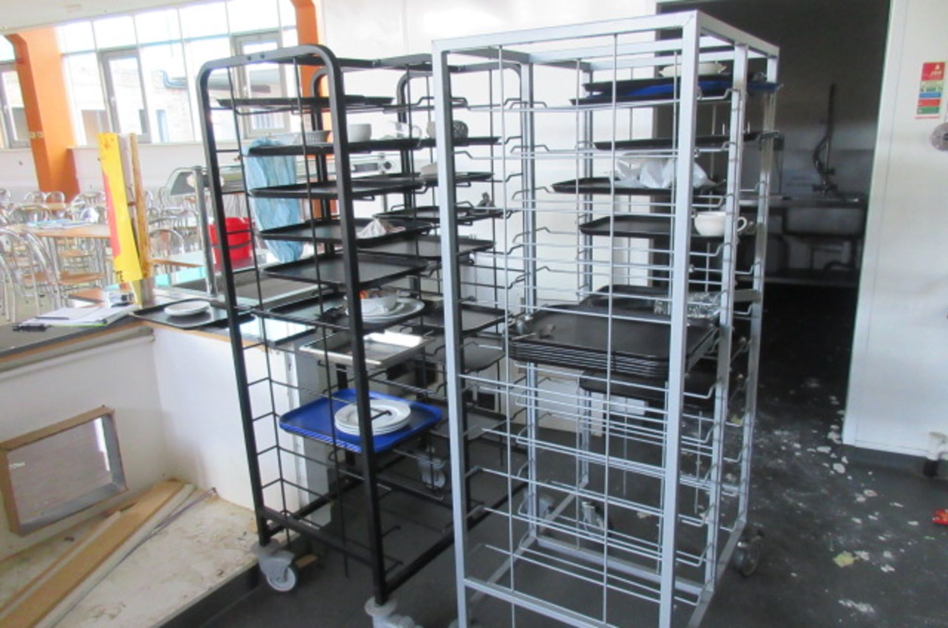 Two mobile tray racks and trays