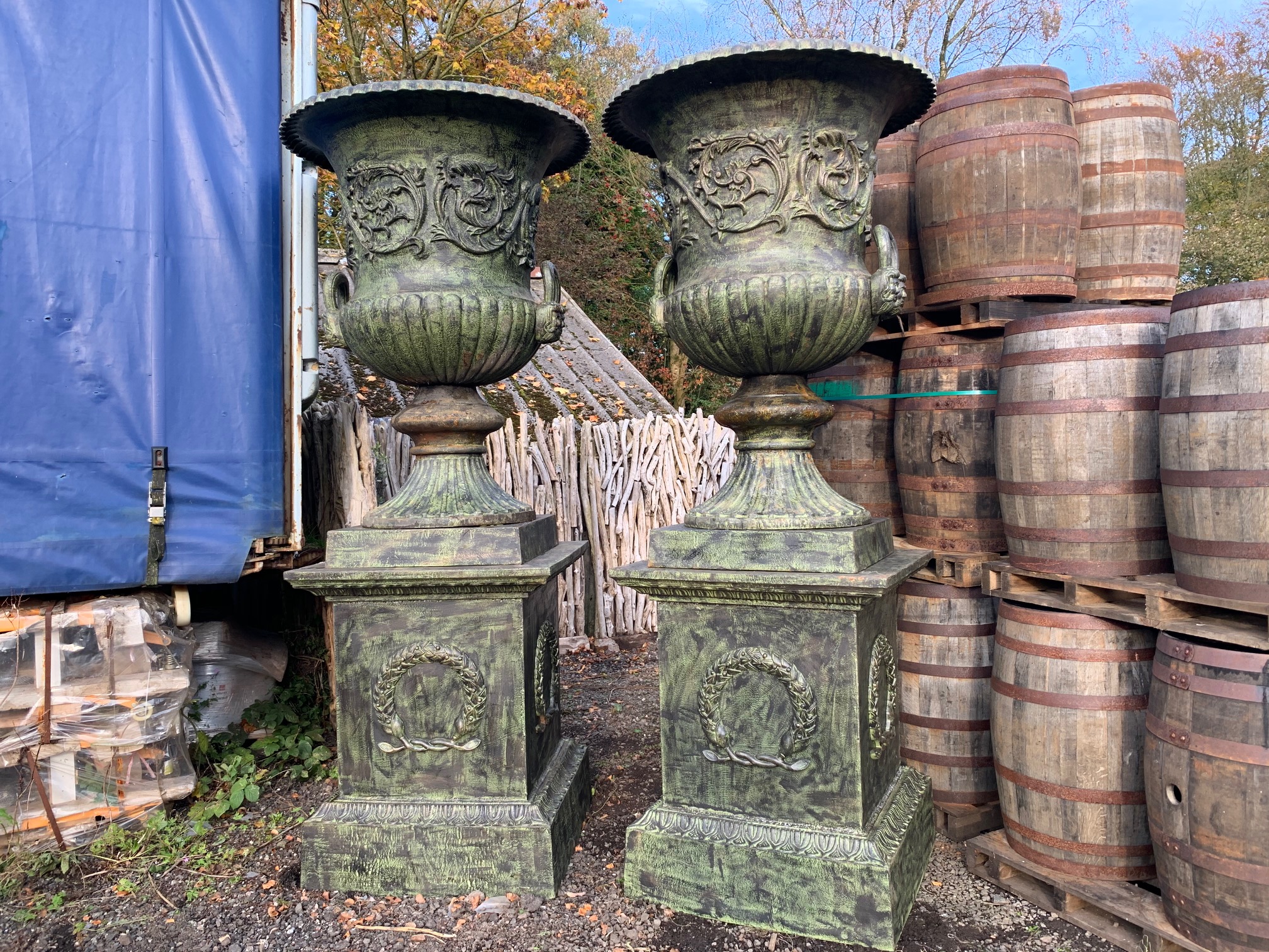 2.8M HIGH HUGE PAIR EXCEPTIONAL CAST IRON MONUMENTAL CAMPANA STYLE URNS ON PLINTH, IN THE MANNER OF