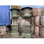 2.8M HIGH HUGE PAIR EXCEPTIONAL CAST IRON MONUMENTAL CAMPANA STYLE URNS ON PLINTH, IN THE MANNER OF