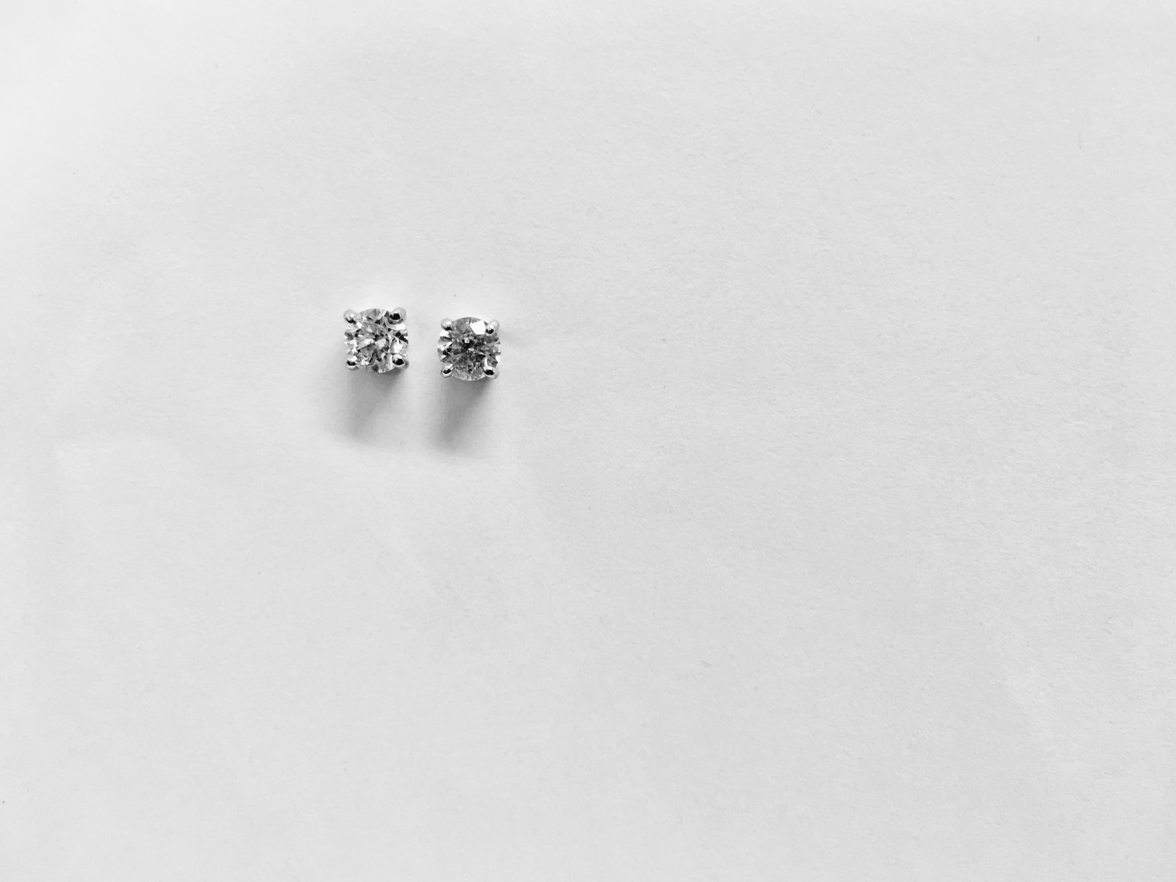 0.15ct Solitaire diamond stud earrings set with brilliant cut diamonds