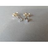 0.10ct Solitaire diamond stud earrings set with brilliant cut diamonds