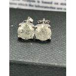 14ct White Gold Diamond stud earrings featuring, 2 round brilliant cut Diamonds (2.03ct TDW), 4-claw