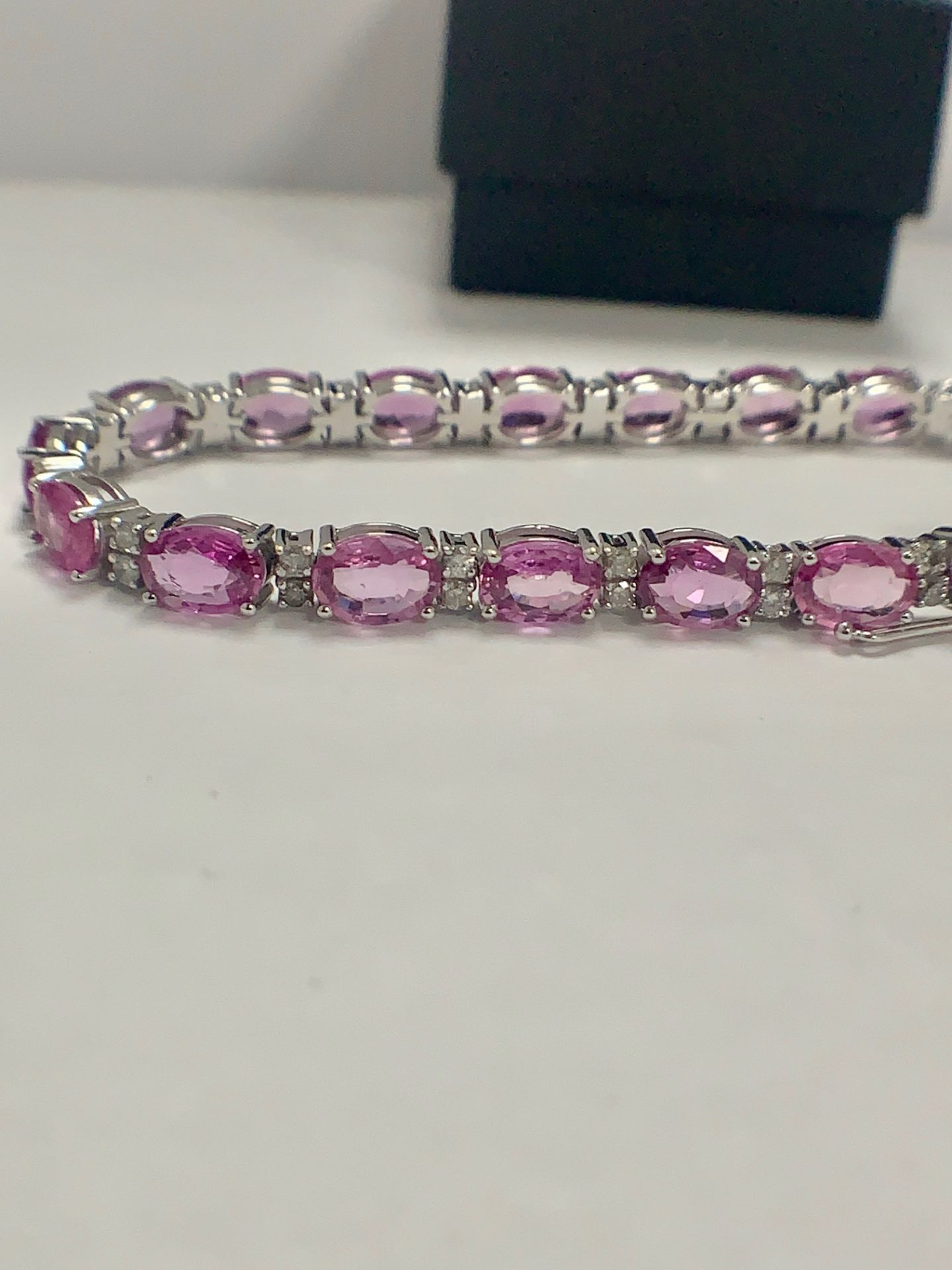 14ct White Gold Sapphire and Diamond bracelet featuring, 19 oval cut, pink Sapphires (15.93ct TSW) - Image 8 of 11