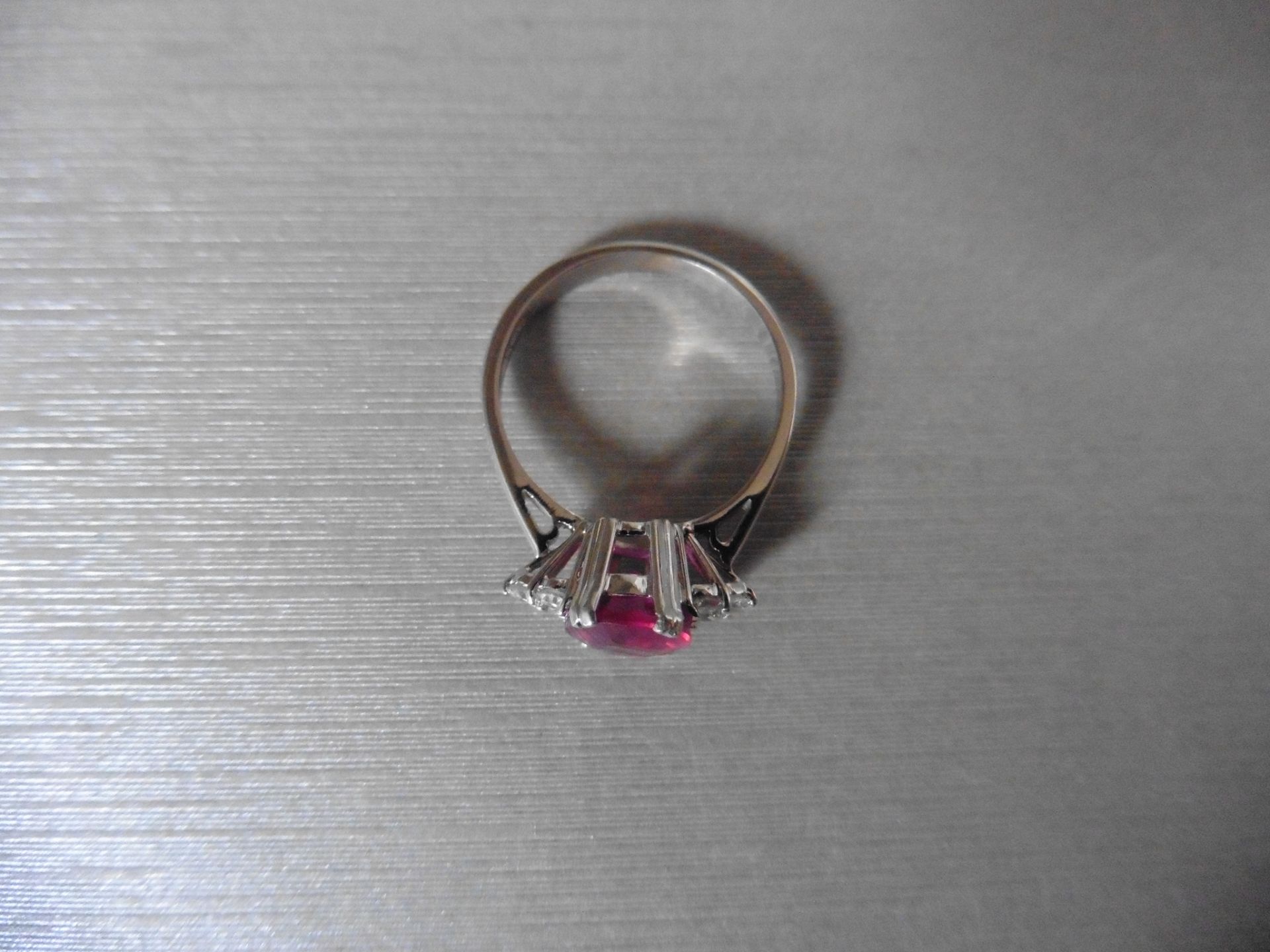 2.50Ct 18Ct White Gold Ruby And Diamond Dress Ring Set With An Oval Cut ( Glass Filled ) Ruby Measur - Image 2 of 3