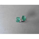 0.60Ct Emerald Stud Style Earrings Set In 9Ct White Gold.