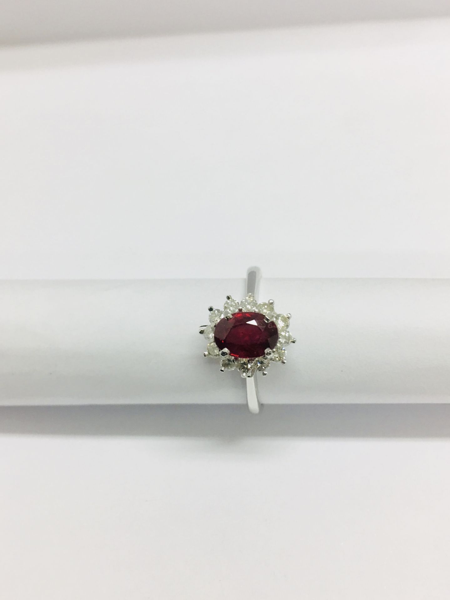 0.80Ct Ruby And Diamond Cluster Ring Set With A Oval Cut(Glass Filled) Ruby Which Is Surrounded By