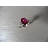 2.50Ct 18Ct White Gold Ruby And Diamond Dress Ring Set With An Oval Cut ( Glass Filled ) Ruby Measur