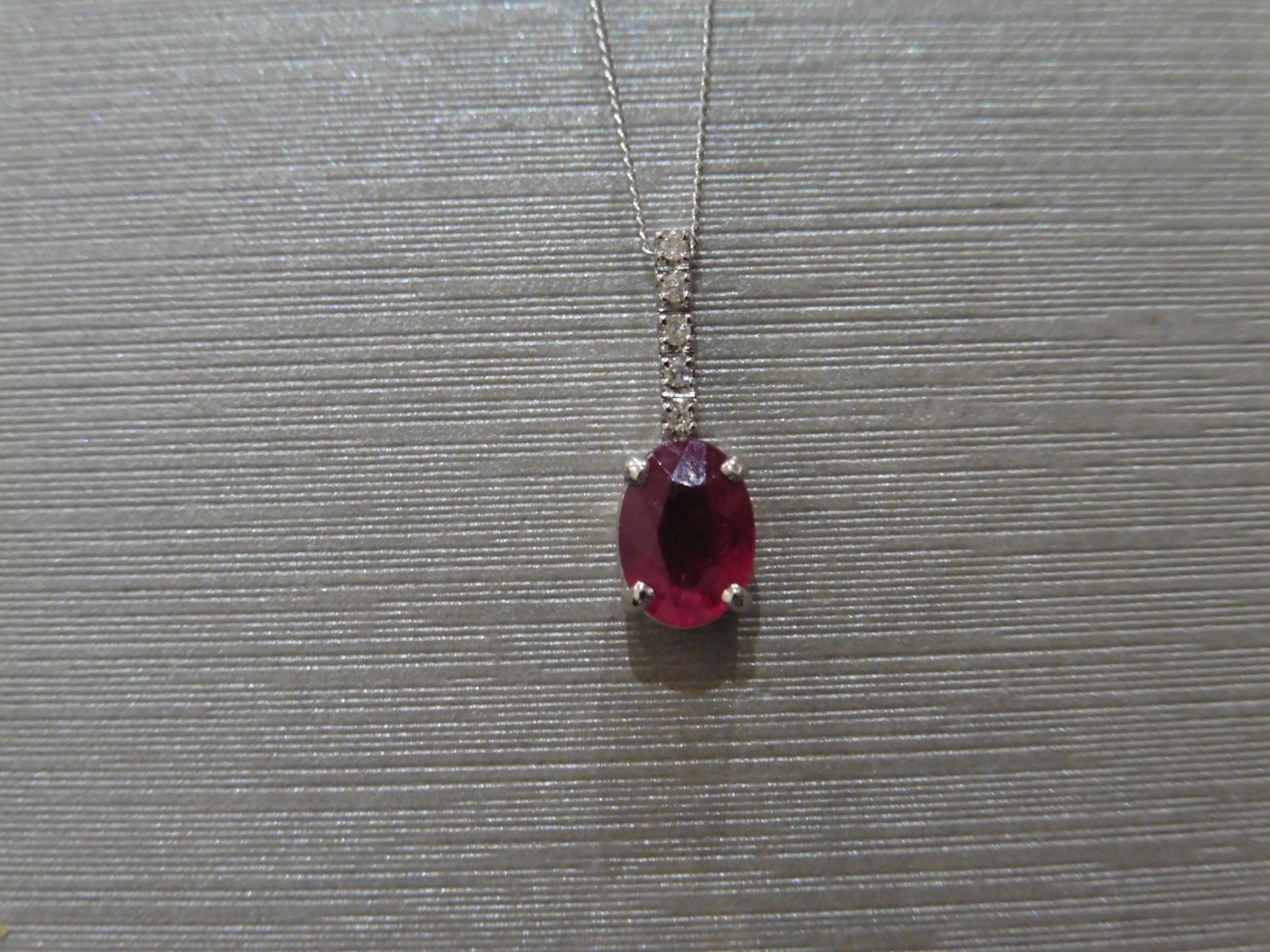 0.80Ct Ruby And Diamond Drop Style Pendant.