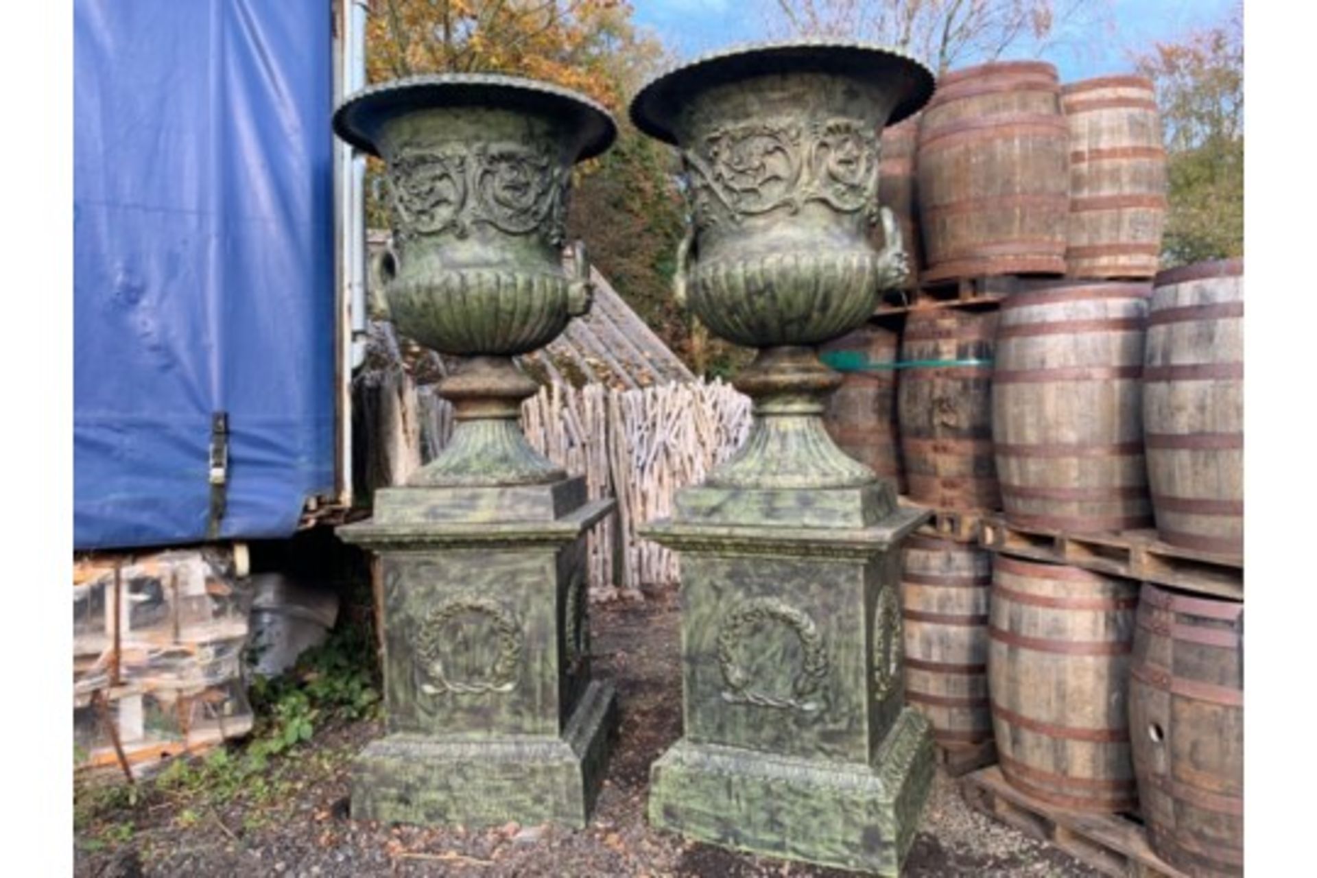 2.8M HIGH HUGE PAIR EXCEPTIONAL CAST IRON MONUMENTAL CAMPANA STYLE URNS ON PLINTH, IN THE MANNER OF