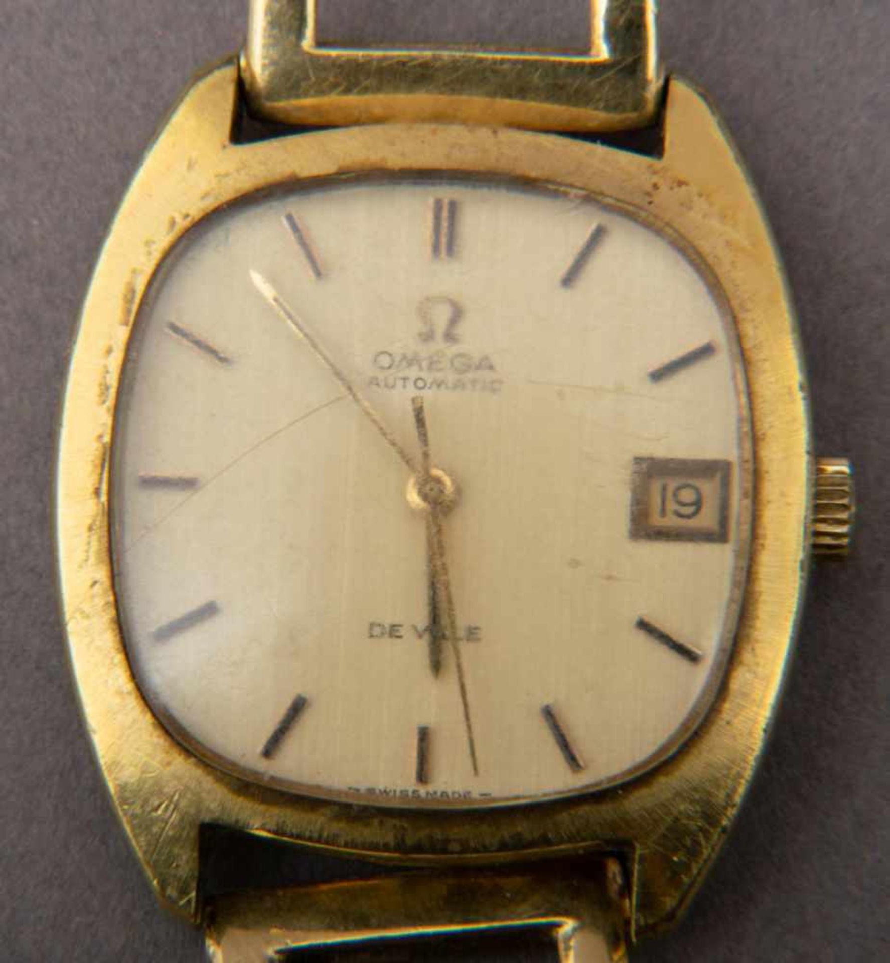 Omega De Ville Herrenarmbanduhr mit 585er Gelbgold-Armband (ca. 20 gr). Handaufzug mit