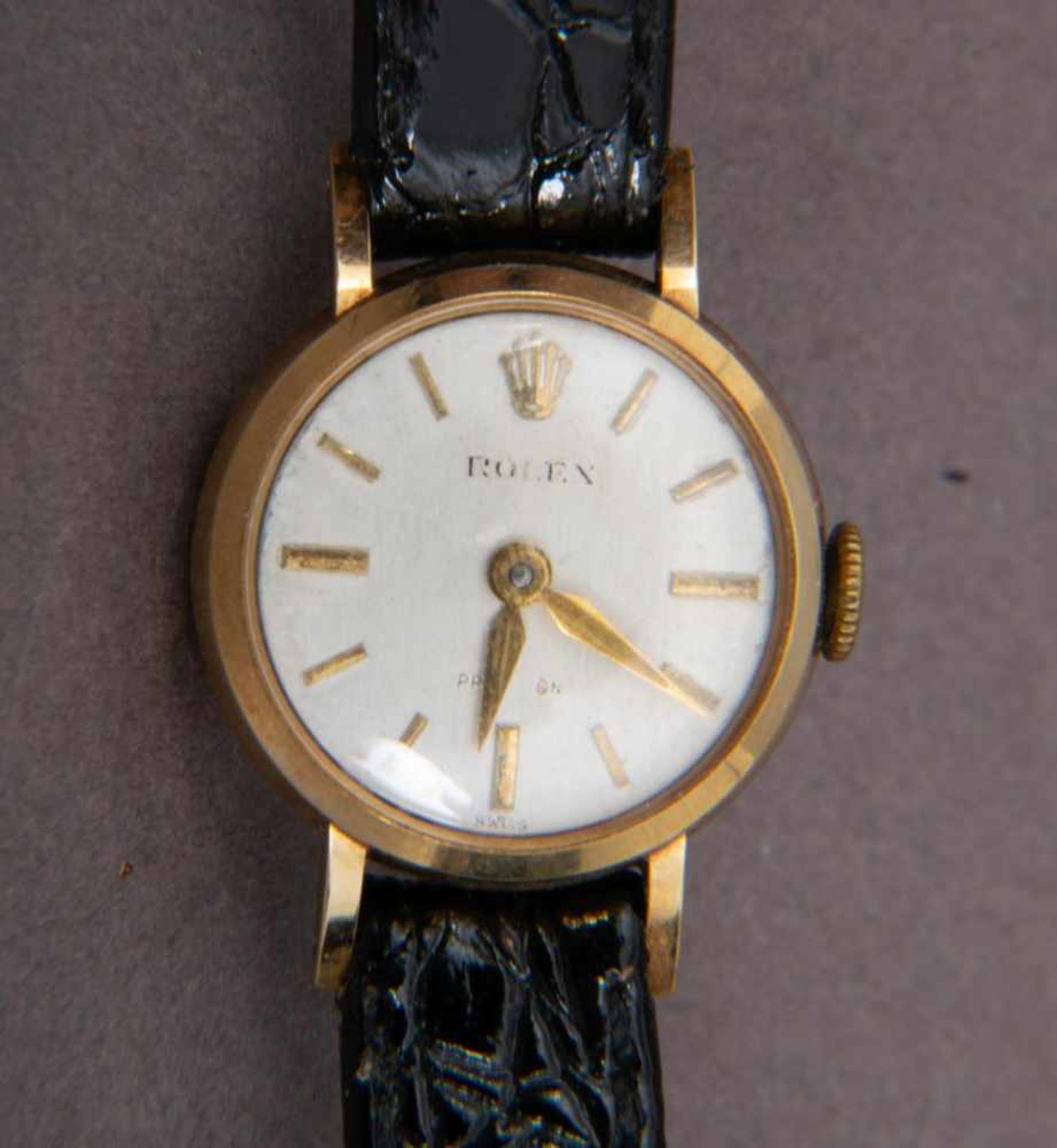 ROLEX - Frühe Damenarmbanduhr. 585er Gelbgoldgehäuse an ergänzten Lederarmband, wohl 1950er Jahre.