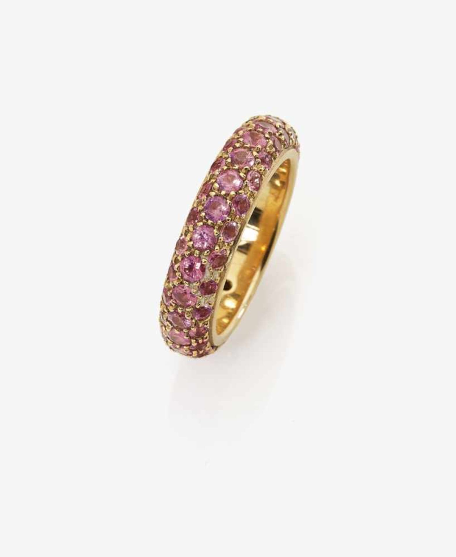 A Pink Sapphire Eternity Ring18K yellow gold (750/-), stamped. Circa 75 small, brilliant-cut rubies,