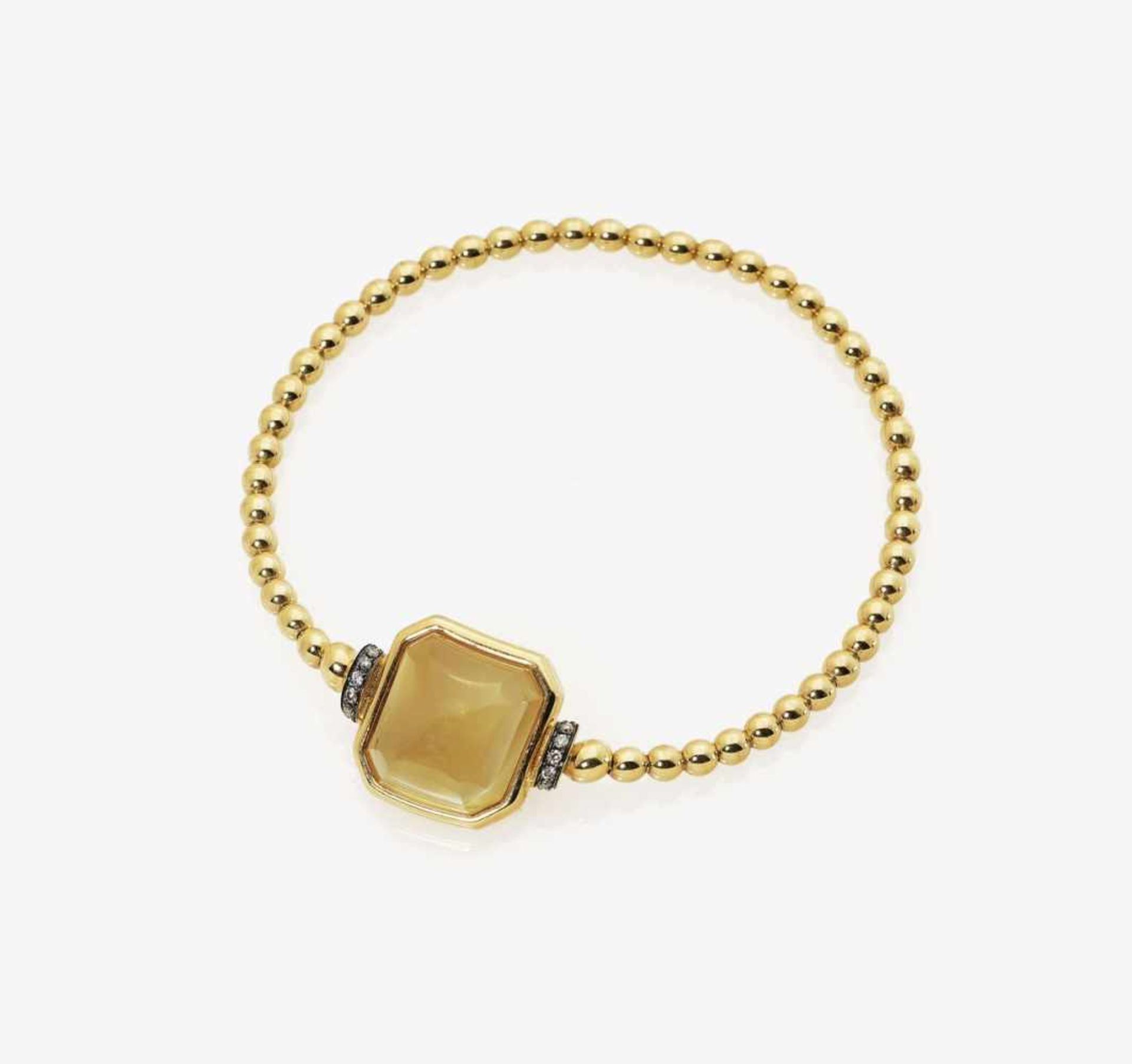 A Citrine and Diamond Bracelet18K yellow gold (750/-), stamped. 10 small, brilliant-cut, brown