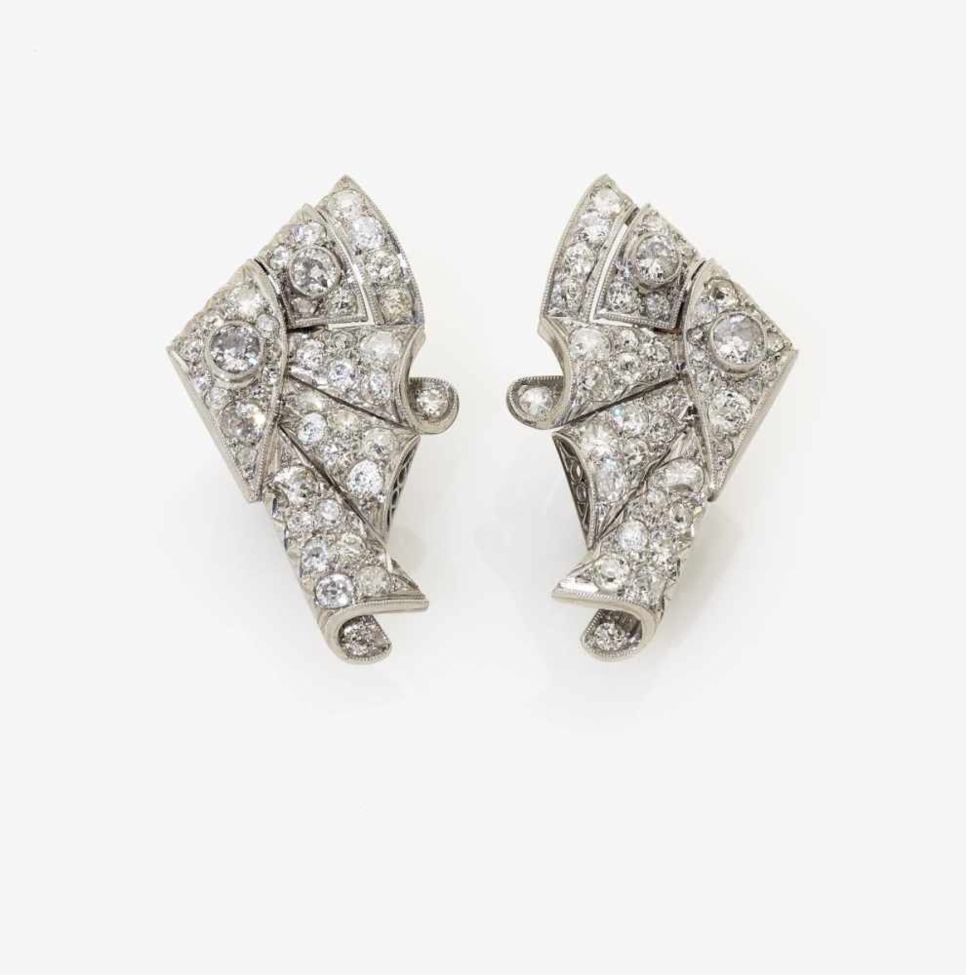 A Pair of Diamond Ear ClipsUSA, 1940-1950s Platinum 950/-, tested. 82 old-cut diamonds, together