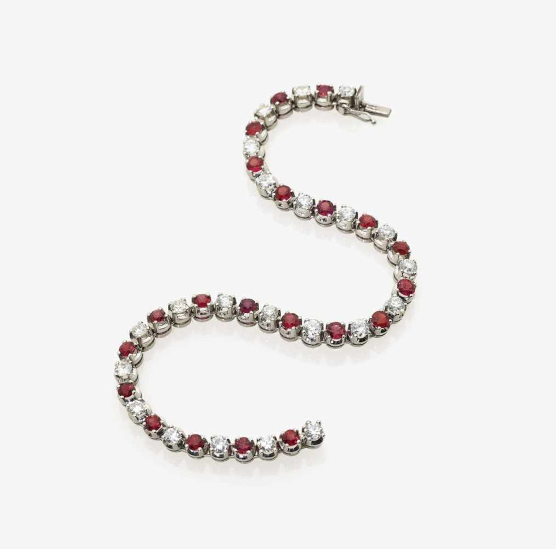 A Diamond and Ruby BraceletGermany 18K white gold (750/-), stamped. 22 brilliant-cut diamonds,