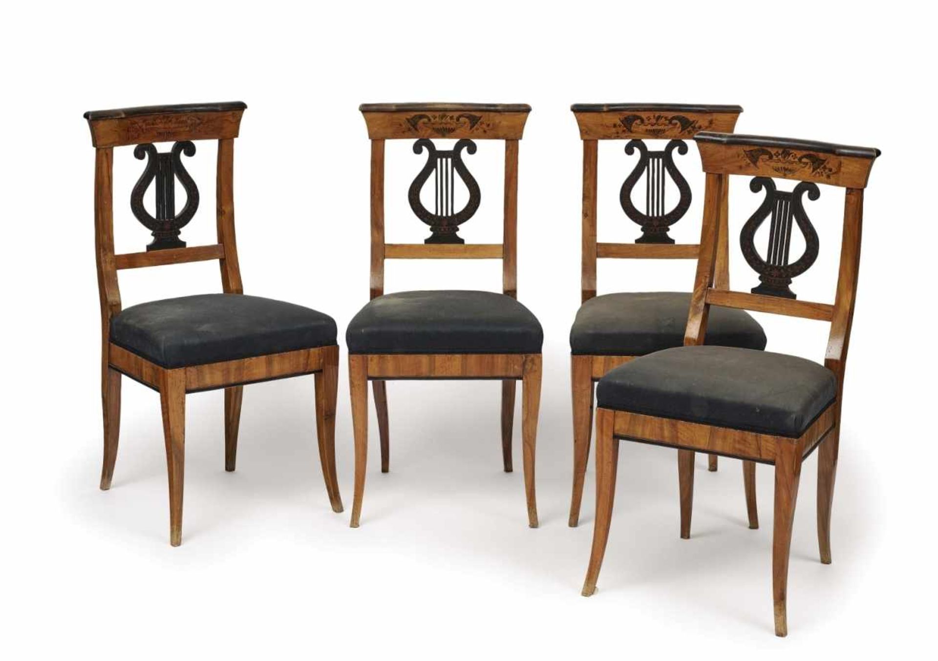 A set of four chairsSouth German, 1st half of the 19th century Veneer of walnut. Wood, blackened.