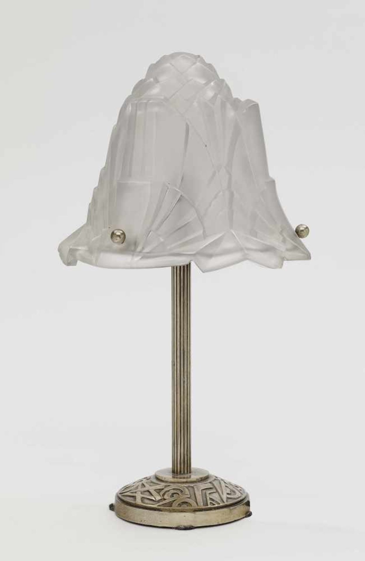 Three Art Deco table lampsFrance, circa 1930 Metal base, ornamental relief. Glass shade, frosted