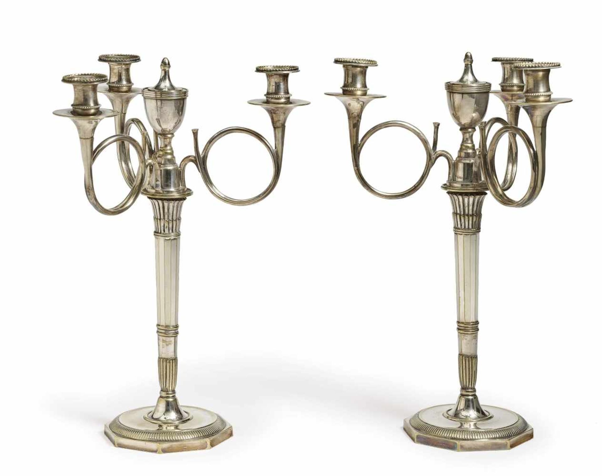 A pair of 4-light girandolesFrance, 19th century Bronze, silver-plated. Volute arms. Height 42 cm.
