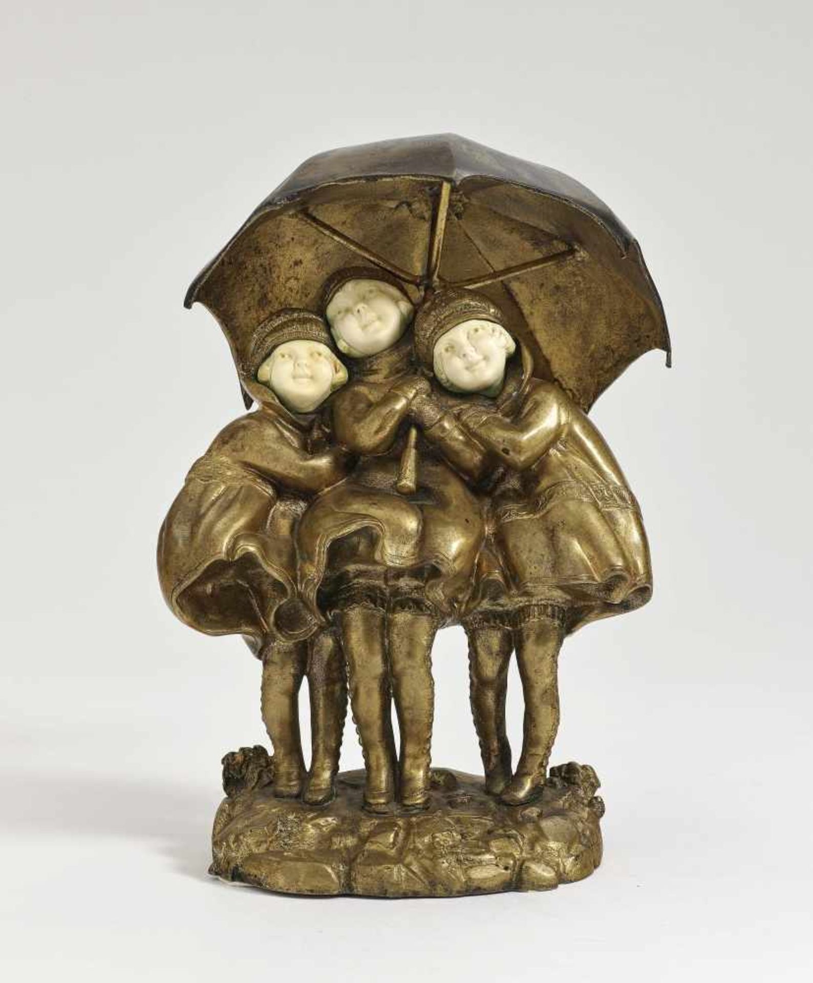 Three Children with UmbrellaDemètre H. Chiparus, circa 1925 Bronze, patinated in gold and brown.