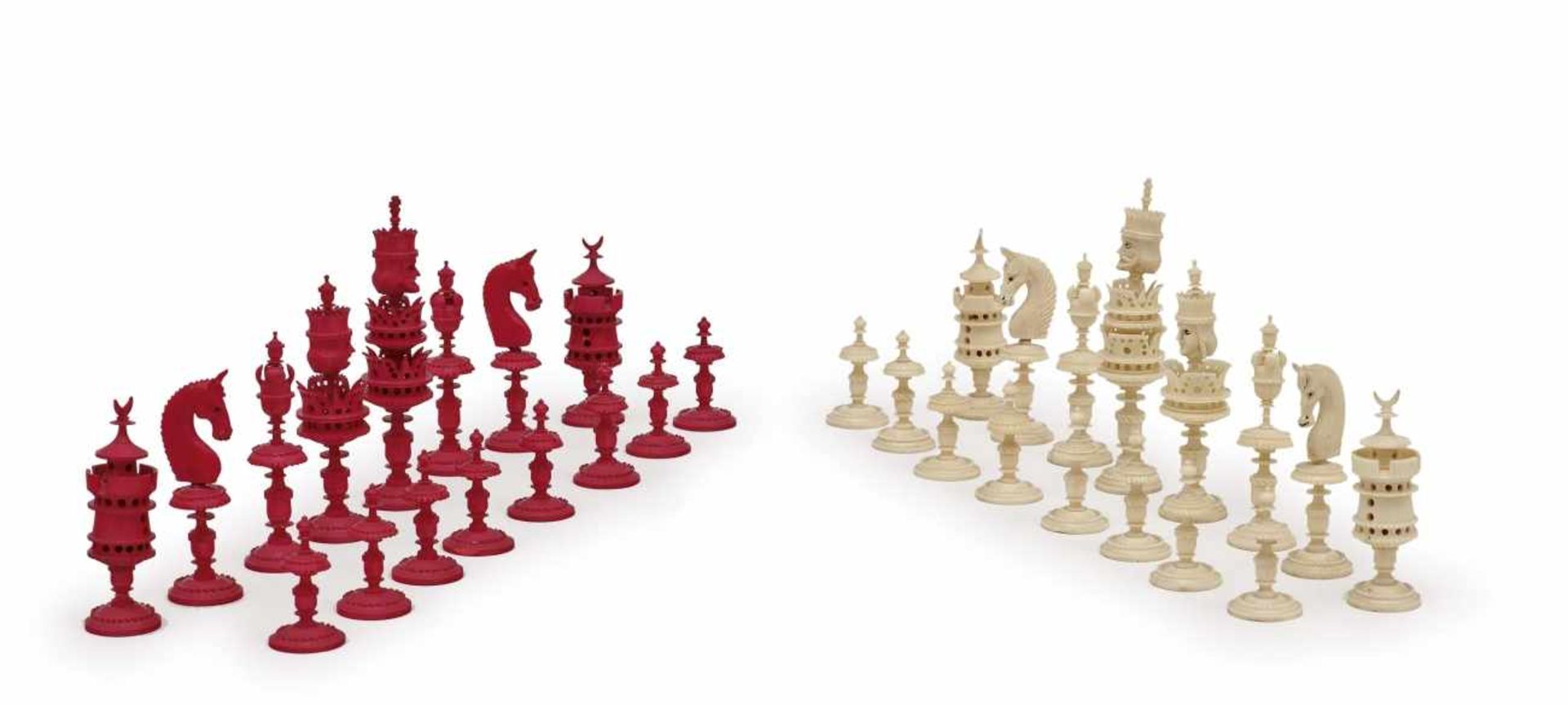 A chess gameSouth German, 19th century Ivory figures, turned, partly coloured in red. Maximum height