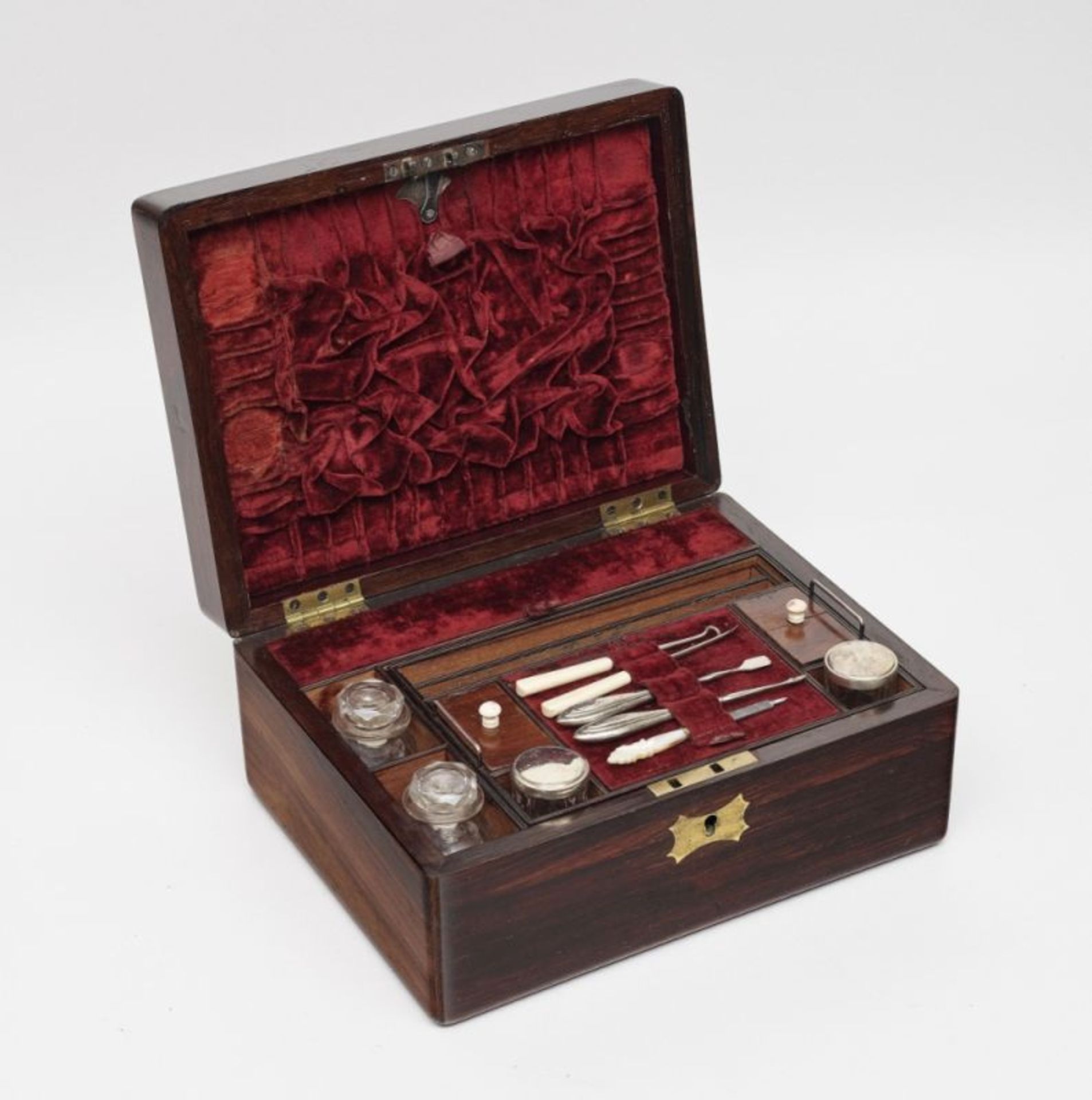 Gentleman's Dressing Case19th Century Rosewood case with red velvet lining. Upper side of lid with