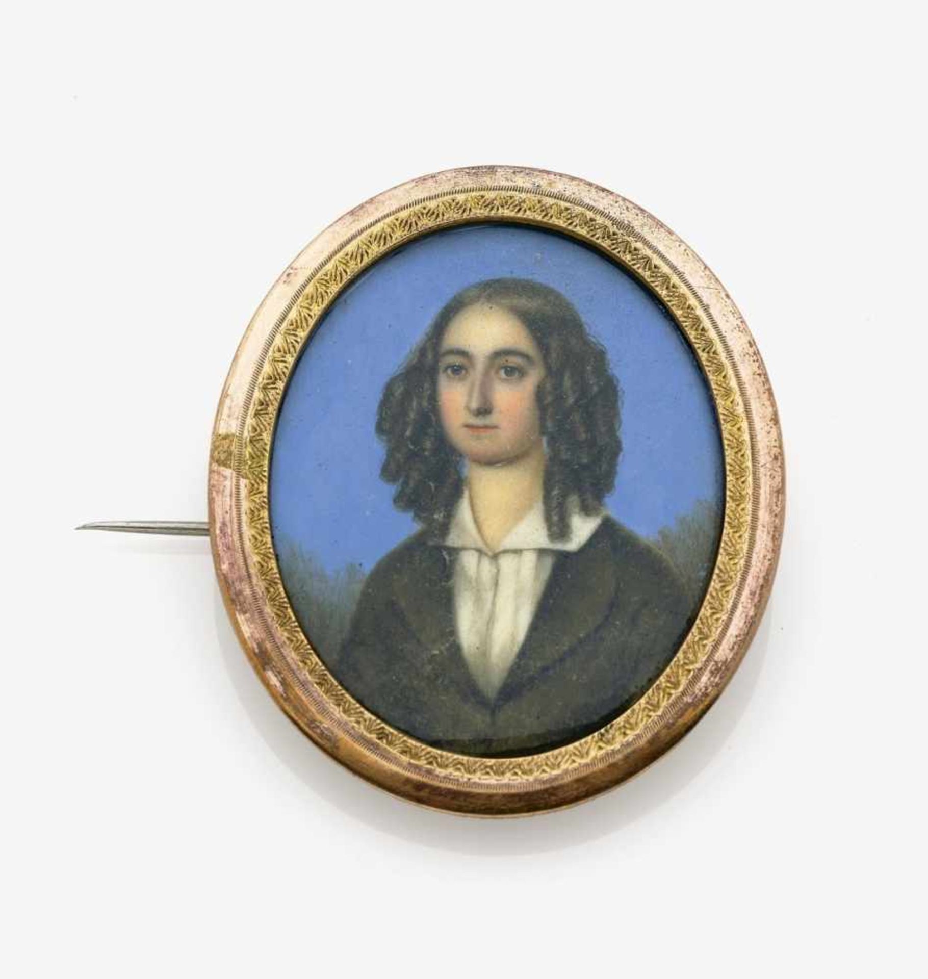 A Brooch with a Portrait MiniatureGermany, circa 1840 Brass. Gouache painted on ivory. Circa 5.6 x