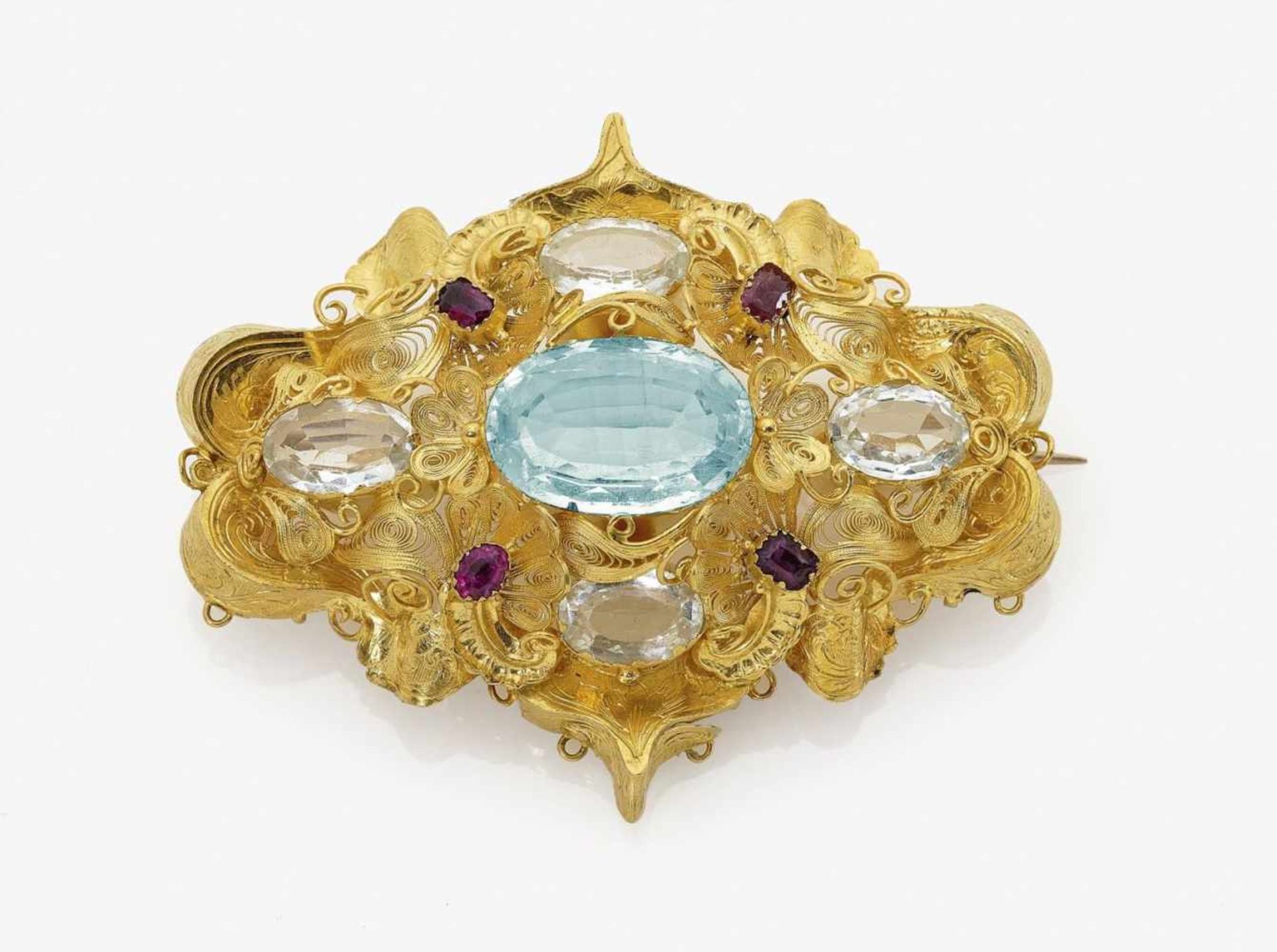 An Aquamarine and Ruby BroochGermany, circa 1820 14K yellow gold (585/-), tested. Gold filigree.