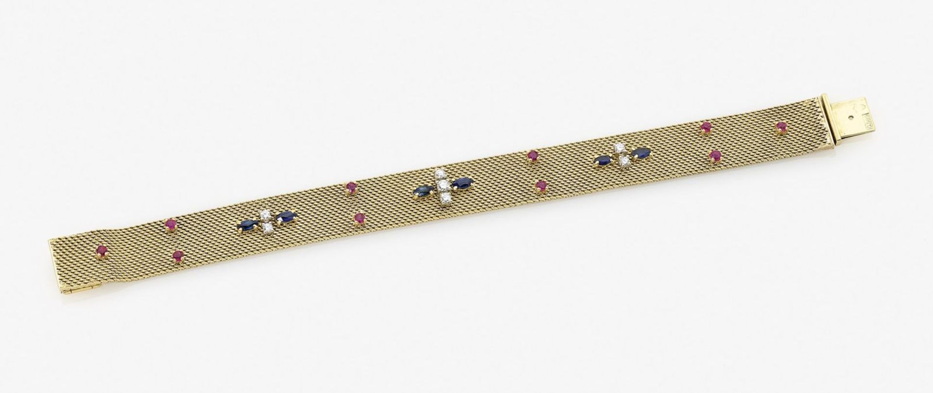 A Diamond, Ruby and Sapphire Cocktail BraceletGermany, 1960s-1970s 14K yellow gold (585/-), stamped.