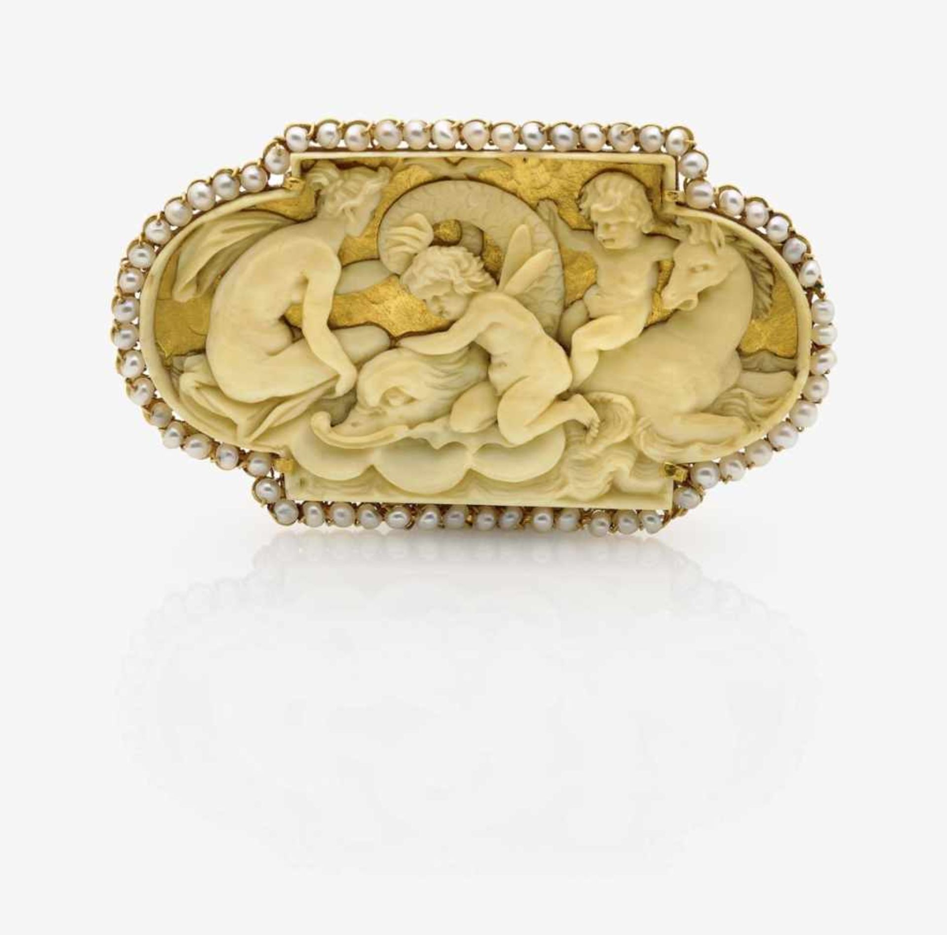 A Carved Ivory Brooch surrounded by PearlsFlanders, 17th Century, setting later 18K yellow gold (