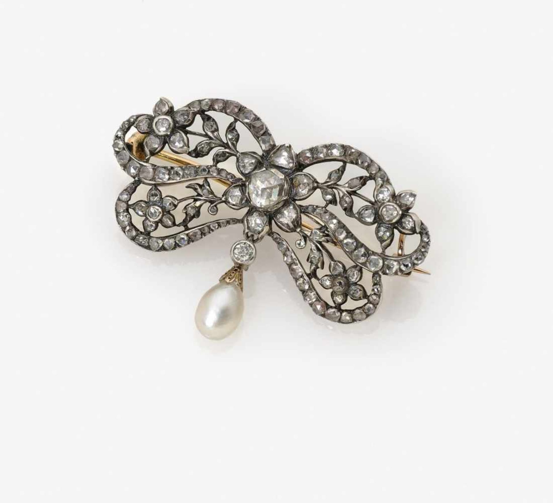 A Diamond and Pearl Bow BroochFrance, circa 1890 18K yellow gold (750/-) and silver, tested. Circa