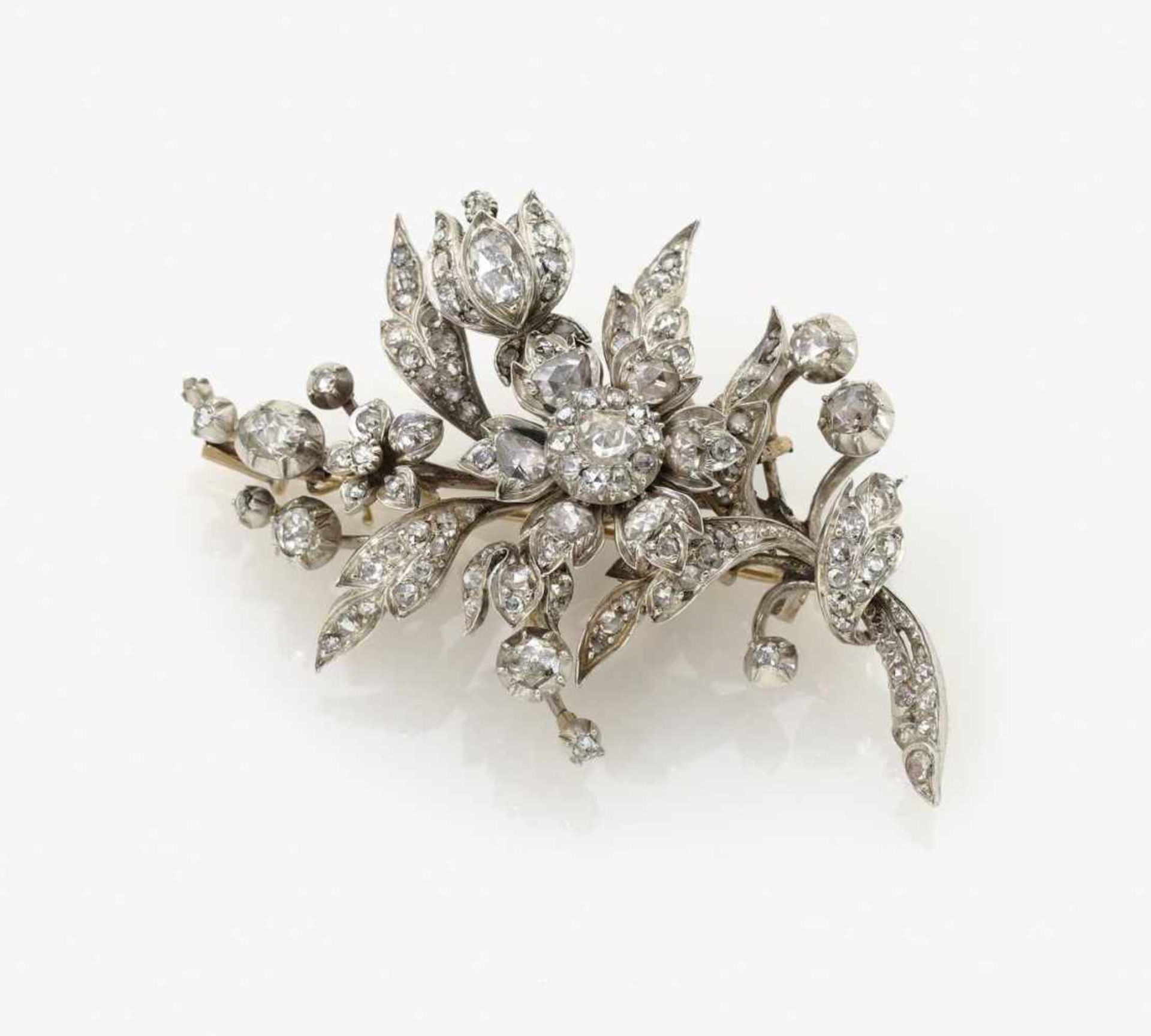 A Diamond Floral Spray BroochNetherlands, circa 1890 14K yellow gold (585/-) and silver, tested.