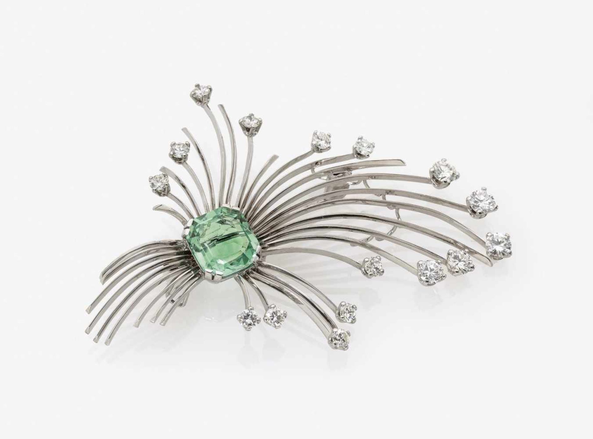 An Emerald and Diamond Spray BroochGermany, 1960s 14K white gold (585/)-, stamped. 16 small,