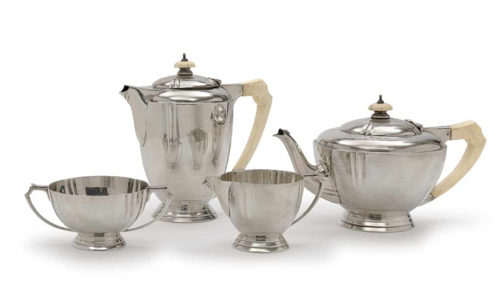 A 4-piece tea and coffee serviceLondon, 1940, Ollivant & Botsford Silver, ivory handles and knobs.