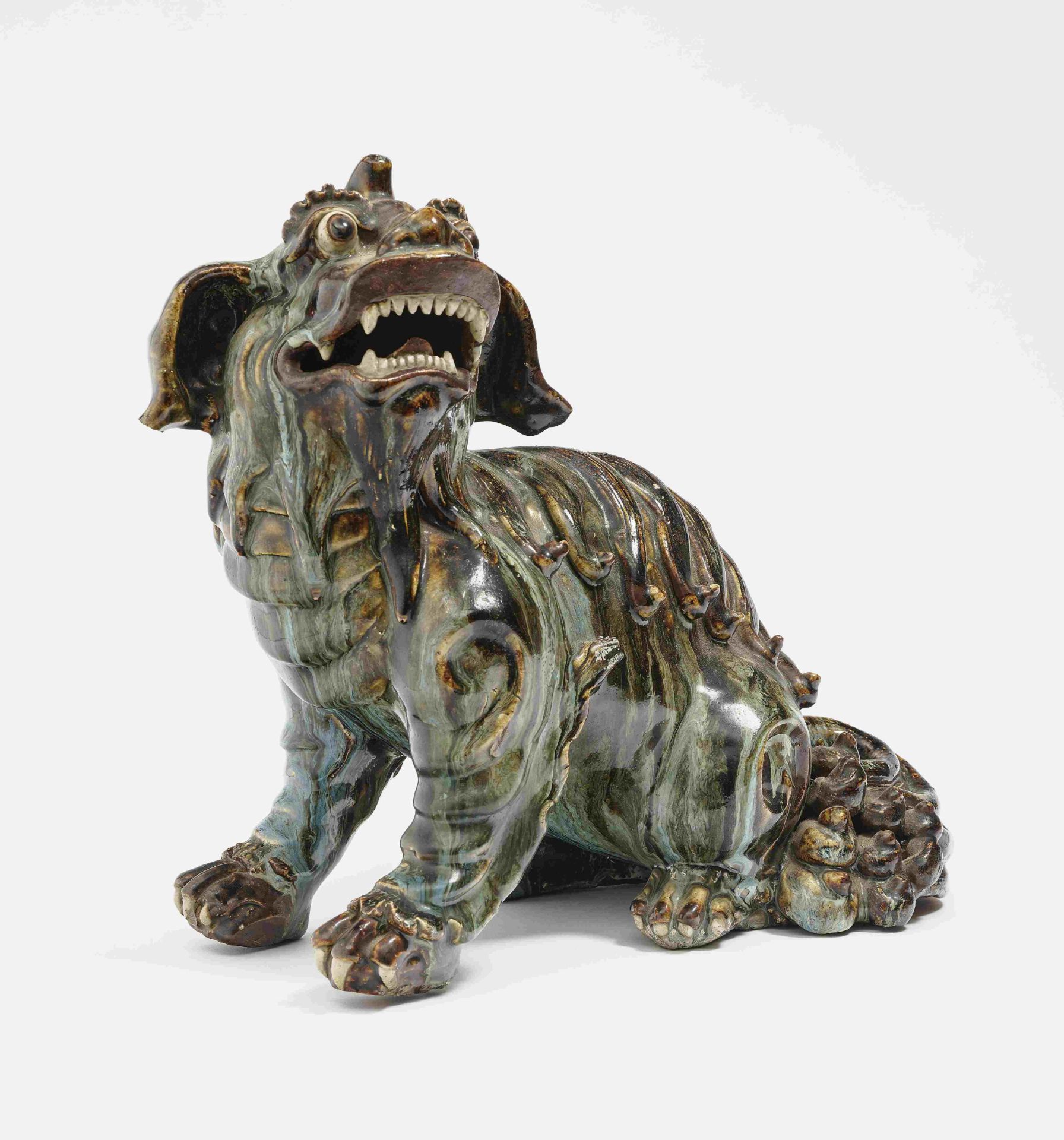 A Dog of Foprobably China, Qing Ceramics. Running glaze. Bumped. Height 31 cm.China, East asian art,