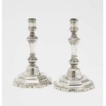 A Pair of CandlesticksParis, 1750 - 1756, master IBF (?) Silver. Engraved coat of arms with crown on