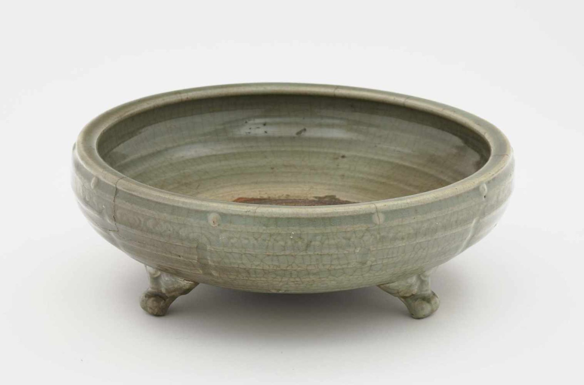 An Incense BurnerChina, Qing Porcelain. Celadon glaze with craquelure. Cracks. Height 11 cm.