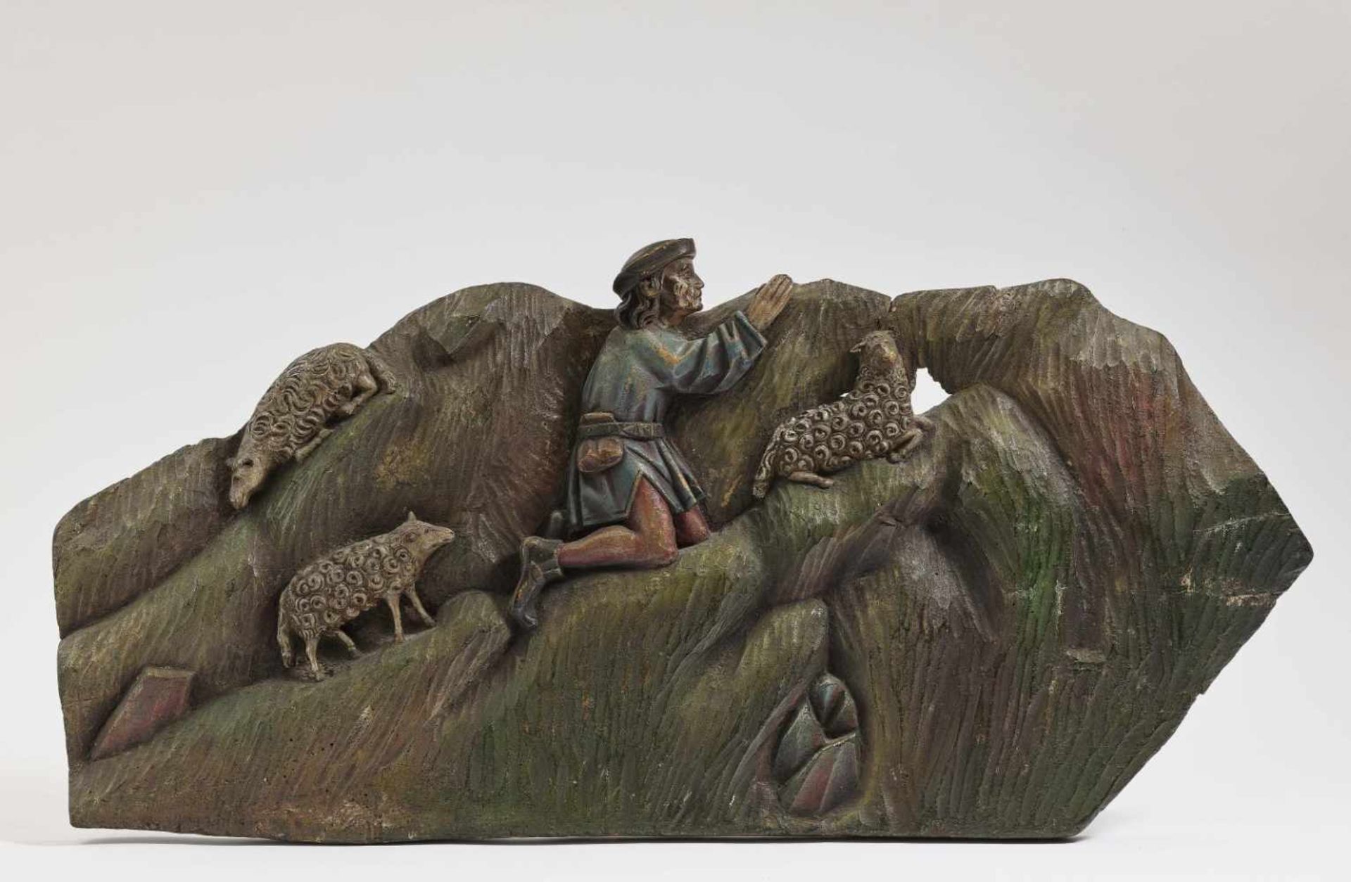 A Praying ShepherdUpper Swabia, circa 1500 Limewood relief. Polychrome painting. 38 x 76 cm.