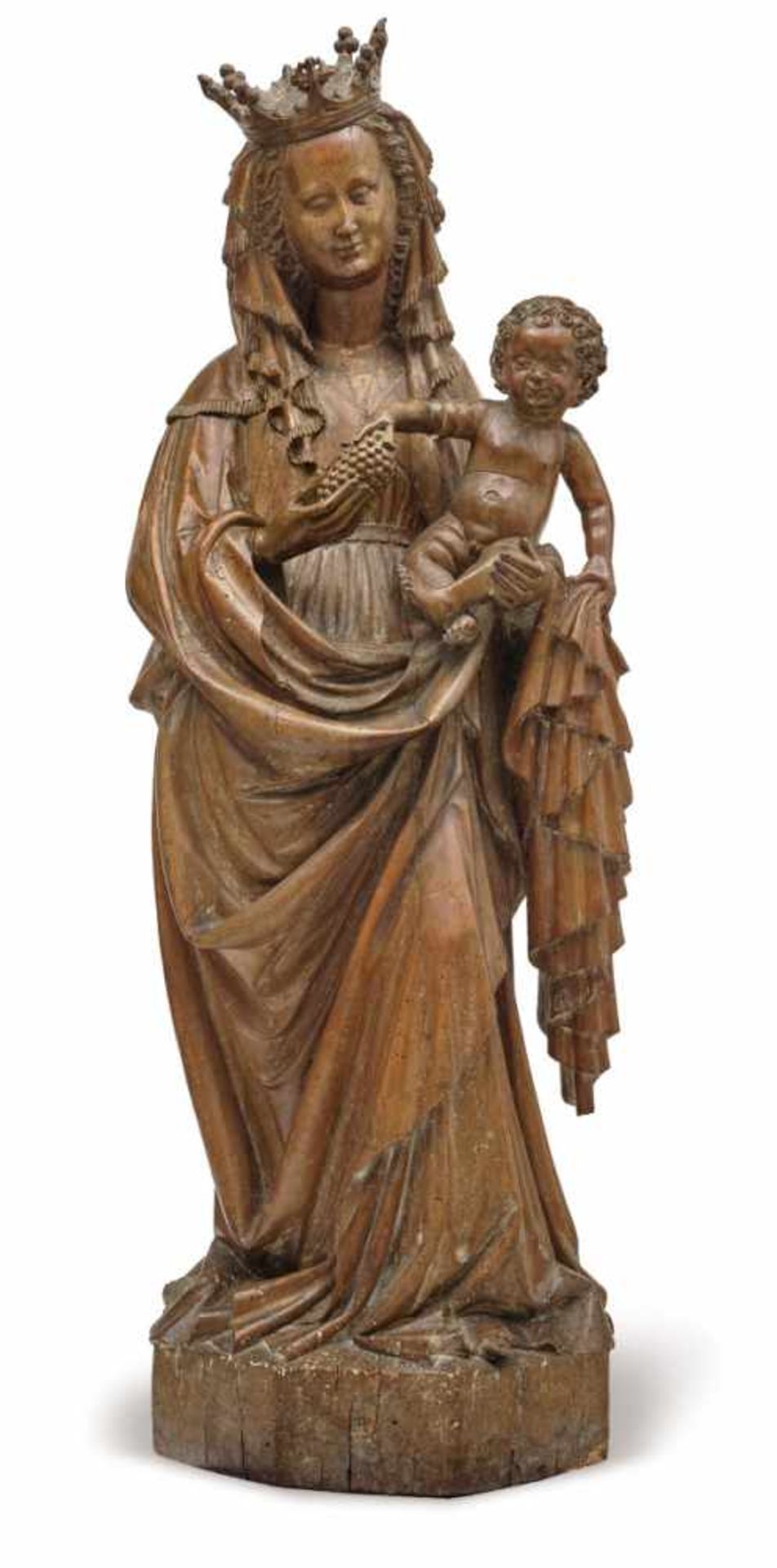 The Virgin and ChildRhenish, circa 1420 Standing contrapposto on a polygonal pedestal, holding the