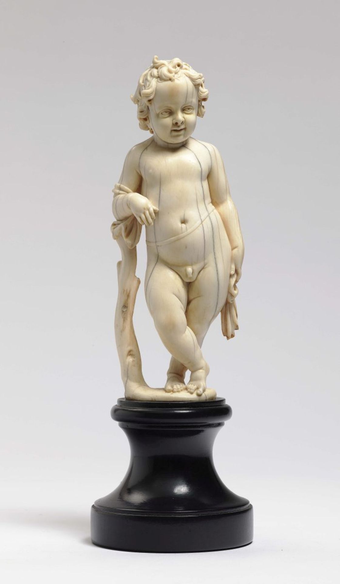 CupidFlemish, 16th Century Ivory, carved in full round. Wings missing. Height 17 cm.Angel,