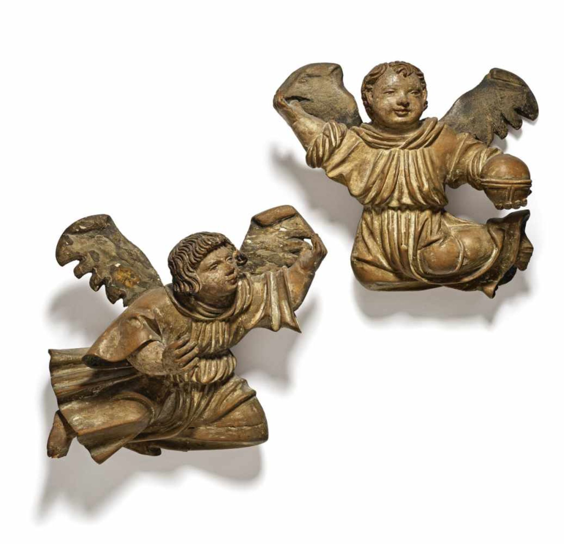 A Pair of AngelsSwabia, mid-16th Century Limewood, reverse flattened, restorations and small losses.