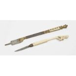A raspFrance, circa 1570 Parcel-gilt iron, etched. Floral engraved ivory handle. Length 24.5 cm.