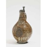 A Bellarmine jugFrechen, 17th Century Grey stoneware. Brown speckled salt glaze. Pewter cover and