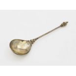A Spoon17th/18th Century Silver, partly gold-plated. Engraved leaf cartouche on underside of the