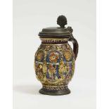 A Stoneware TankardCreussen, dated 1668 Brown, salt-glazed stoneware, embellished in enamels and