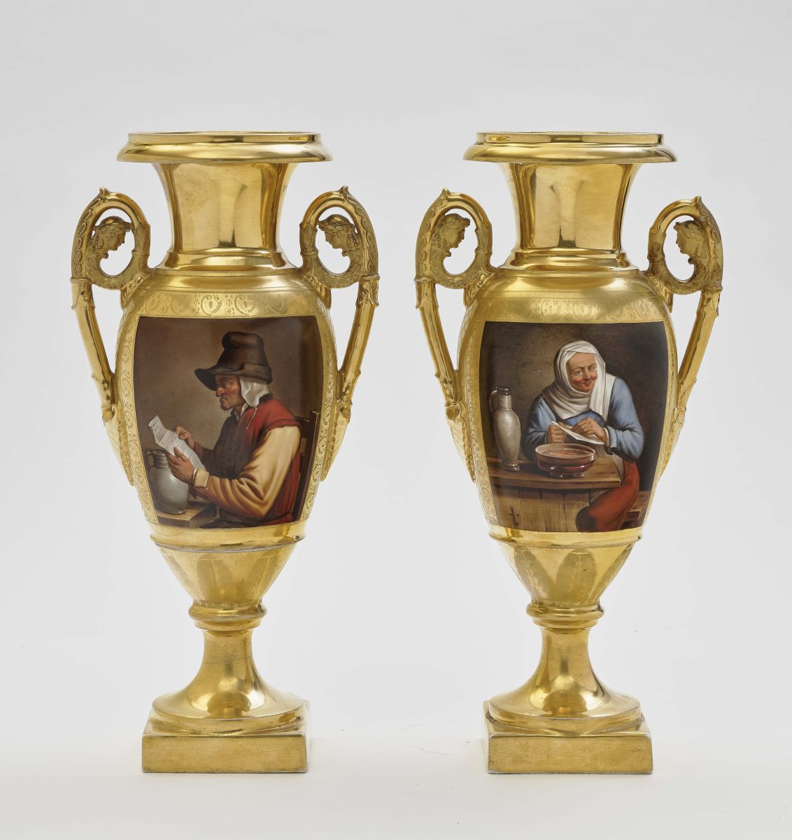 A pair of amphora vases19th century Porcelain, gilt. Base inscribed ''Schoelcker''. One handle