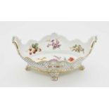 A fruit bowlMeissen Porcelain, polychrome and gold decoration. Relief decoration. Blue crossed