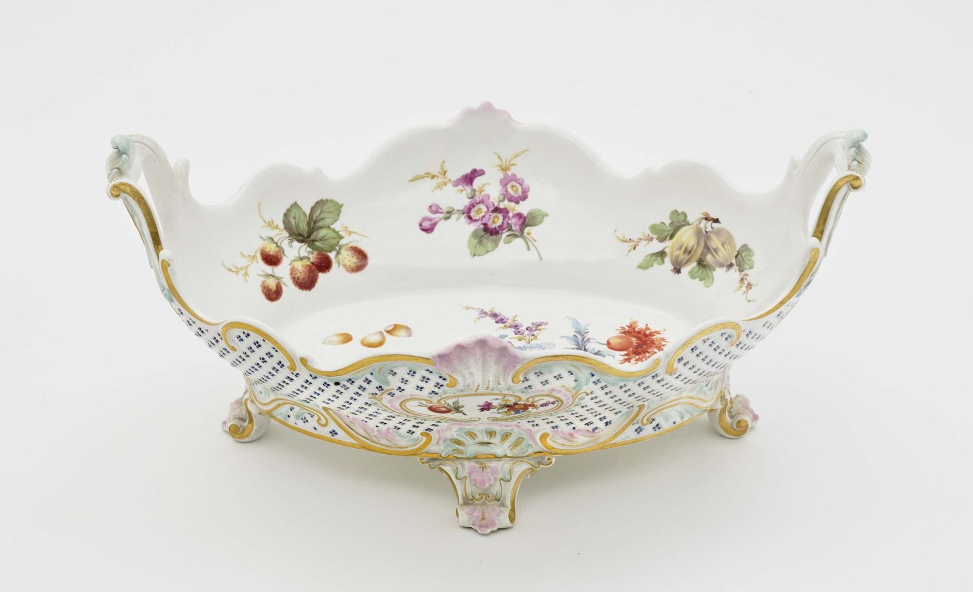 A fruit bowlMeissen Porcelain, polychrome and gold decoration. Relief decoration. Blue crossed