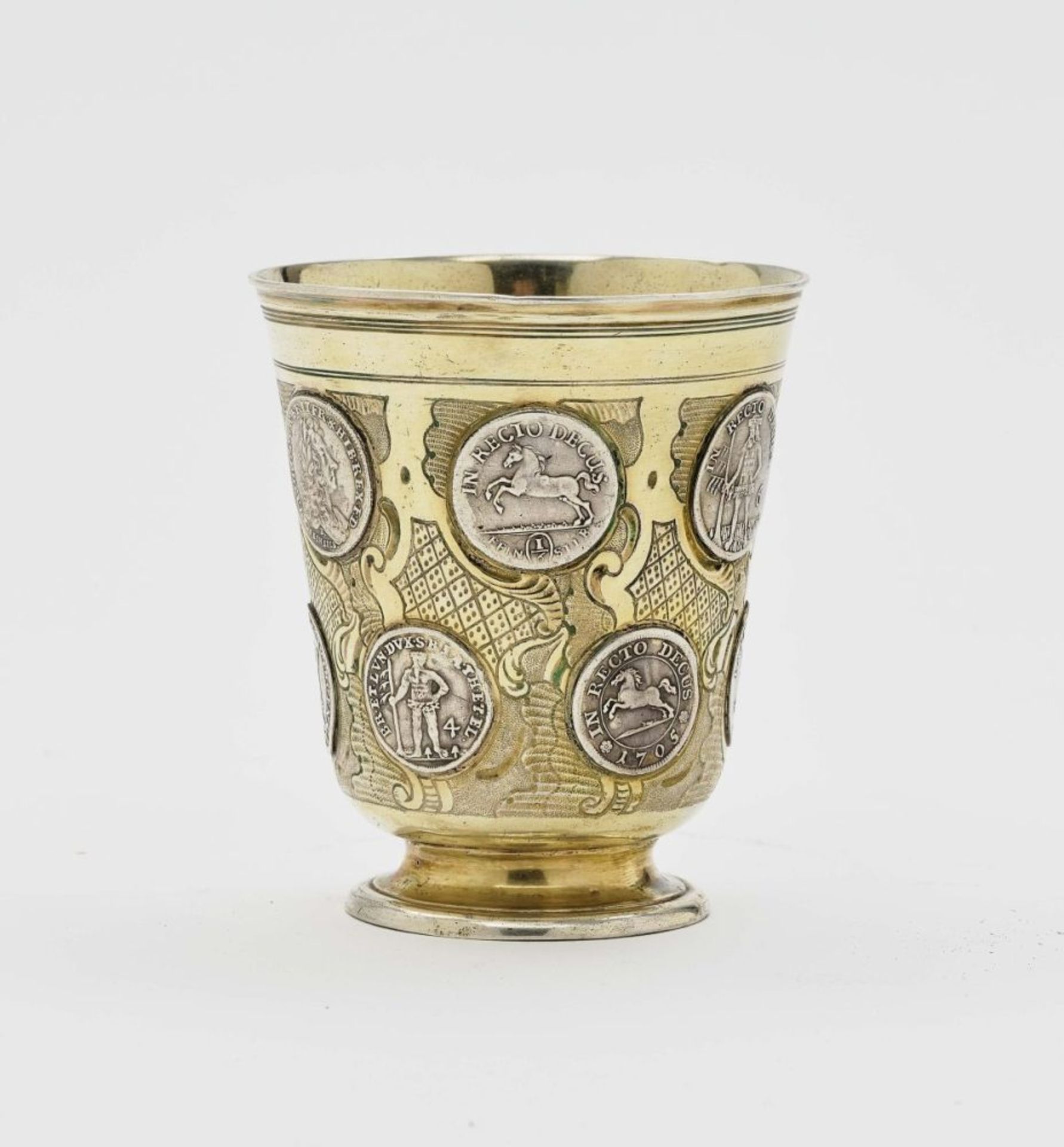 A coin tankardBerlin, mid-18th century, Müller Brothers Silver, partly gilt. Inset silver coins in