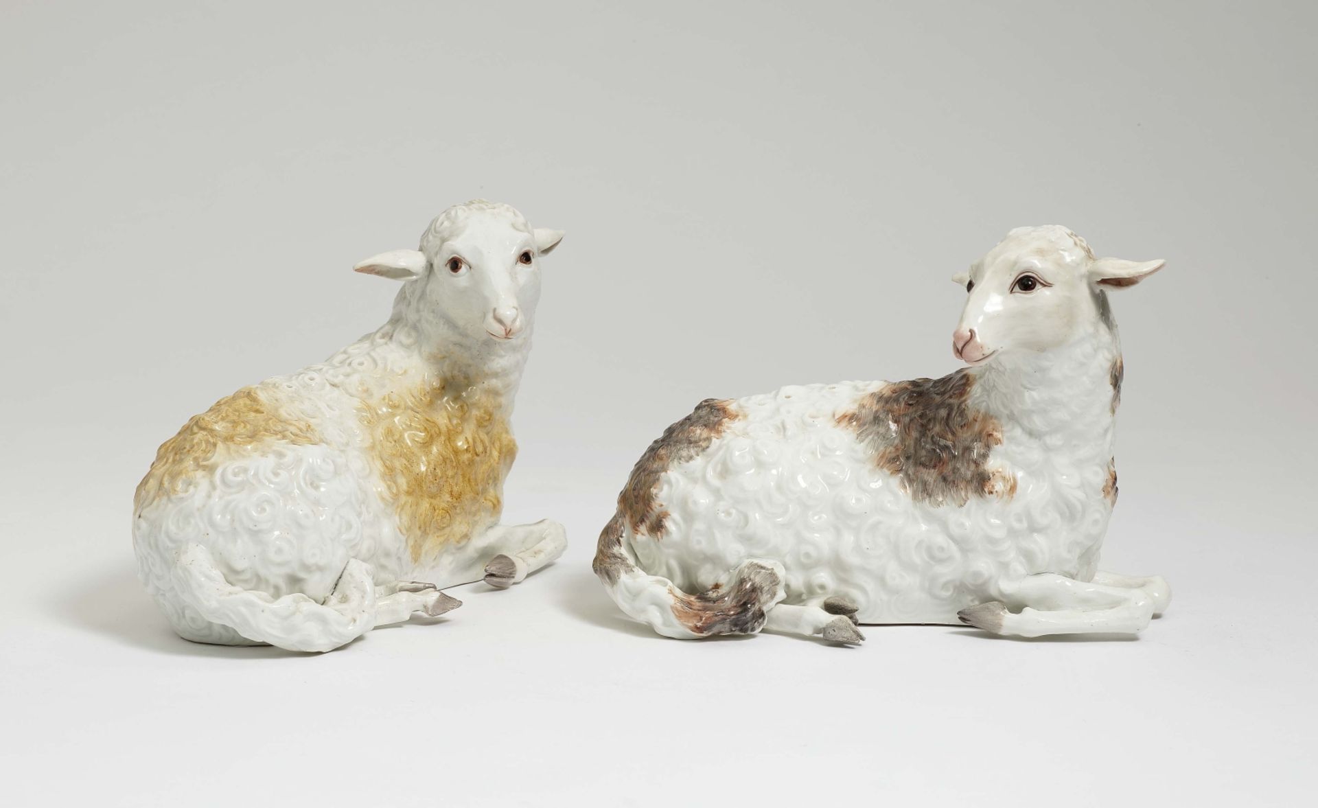 Two Lying SheepMeissen, circa 1760, model by J. J. Kändler and P. Reinicke Porcelain. One with